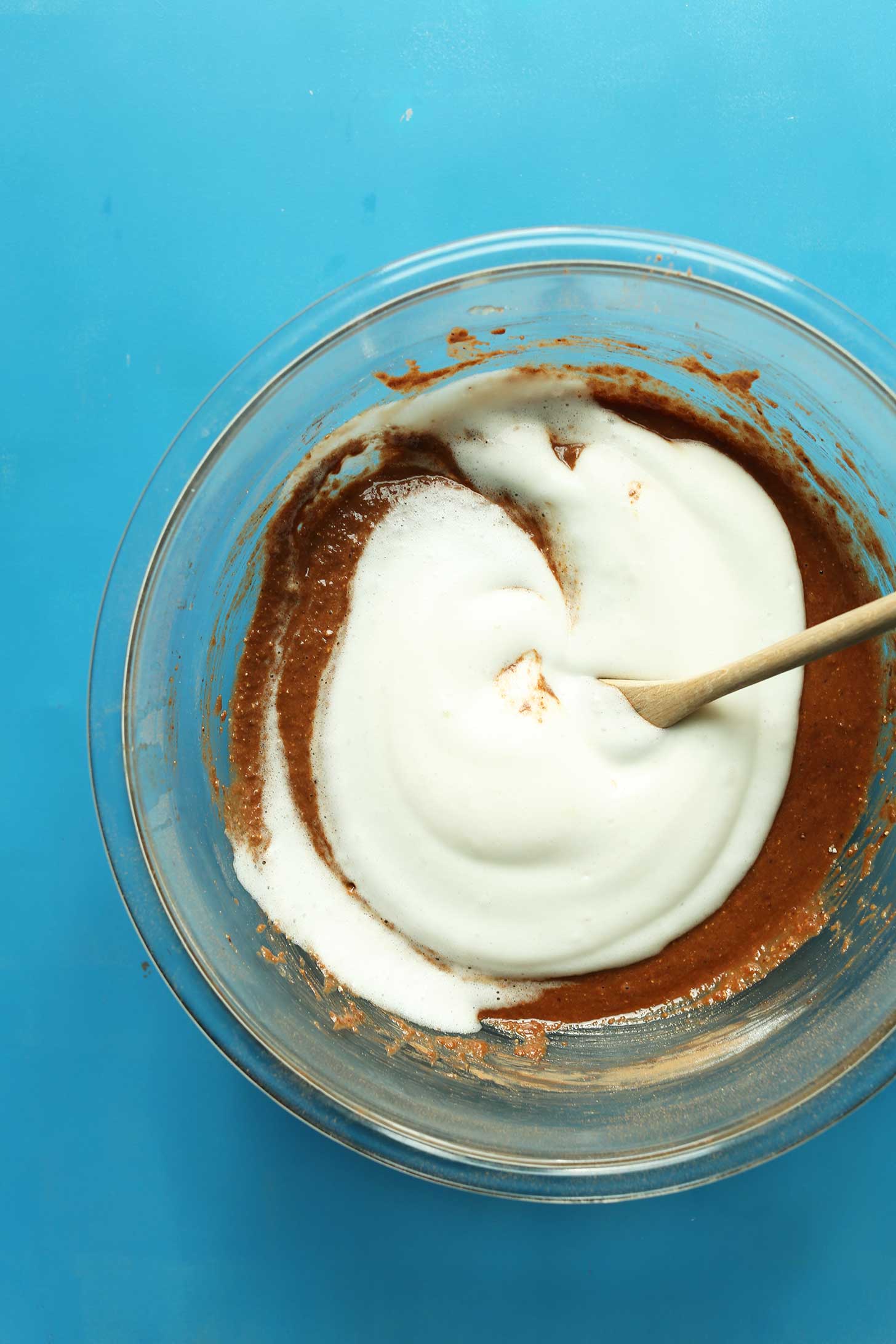 Stirring aquafaba into our gluten-free vegan Chocolate Donut batter