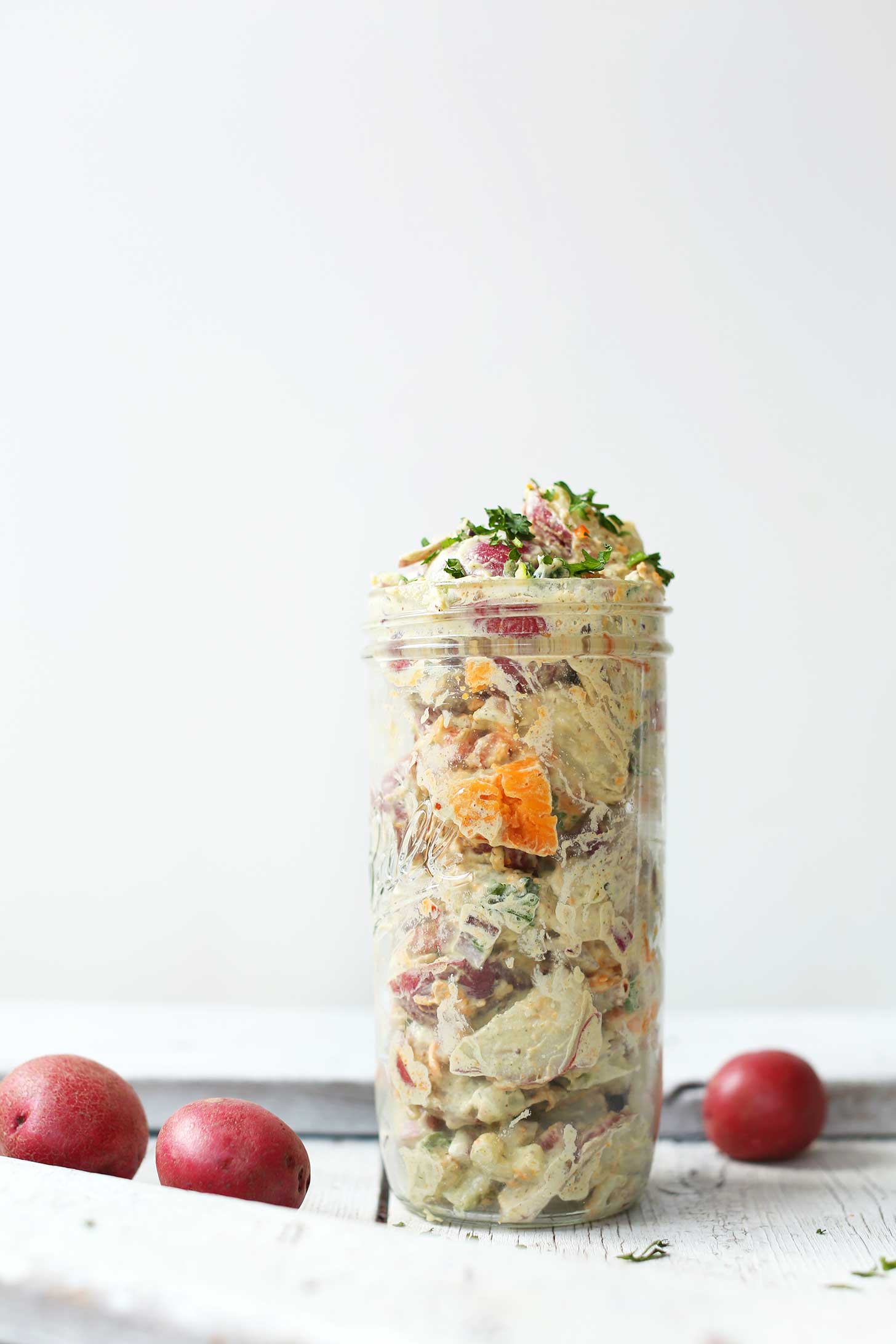 A jar filled with our hearty simple vegan potato salad recipe