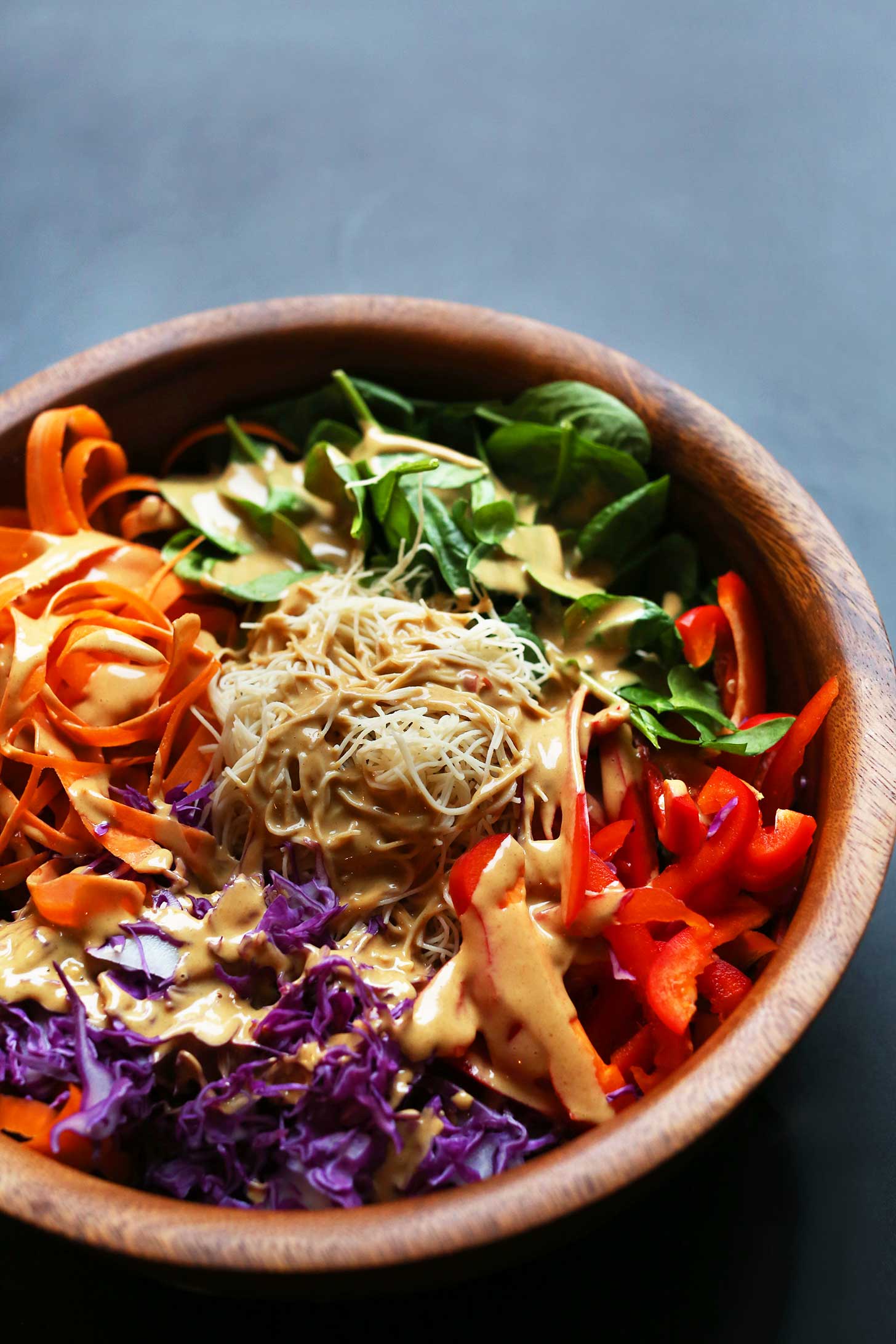 Big bowl filled with protein-packed vegan Thai Salad with Marinated Peanut Tempeh