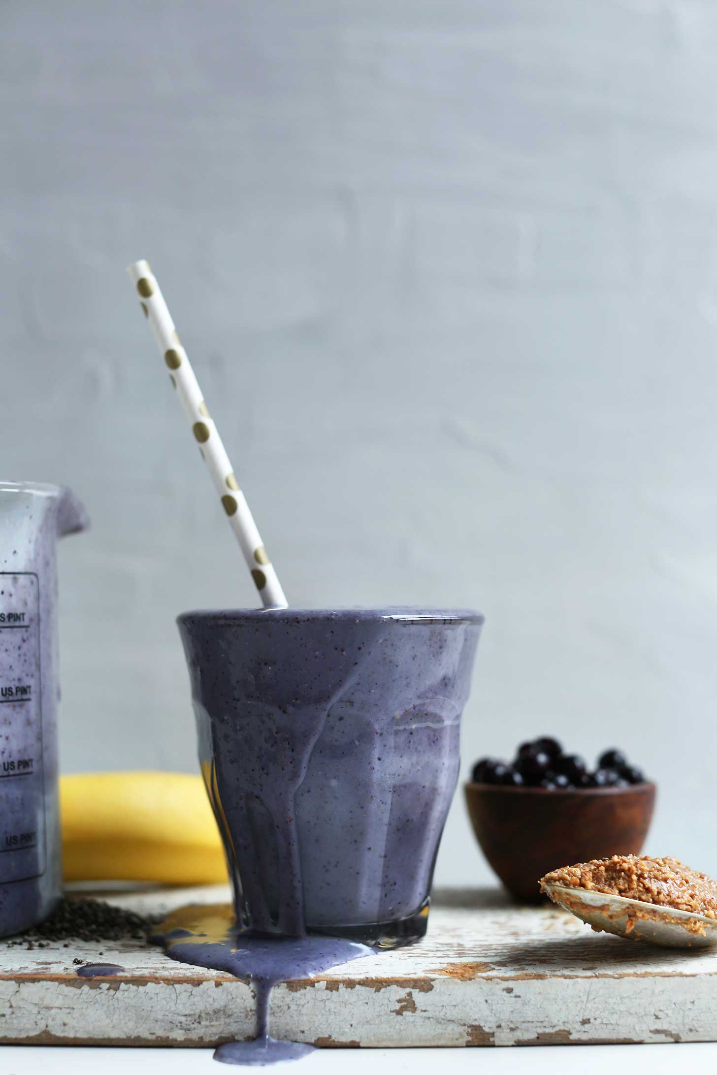 Glass of our nutrient-packed Almond Butter Blueberry Smoothie with Chia and Flax