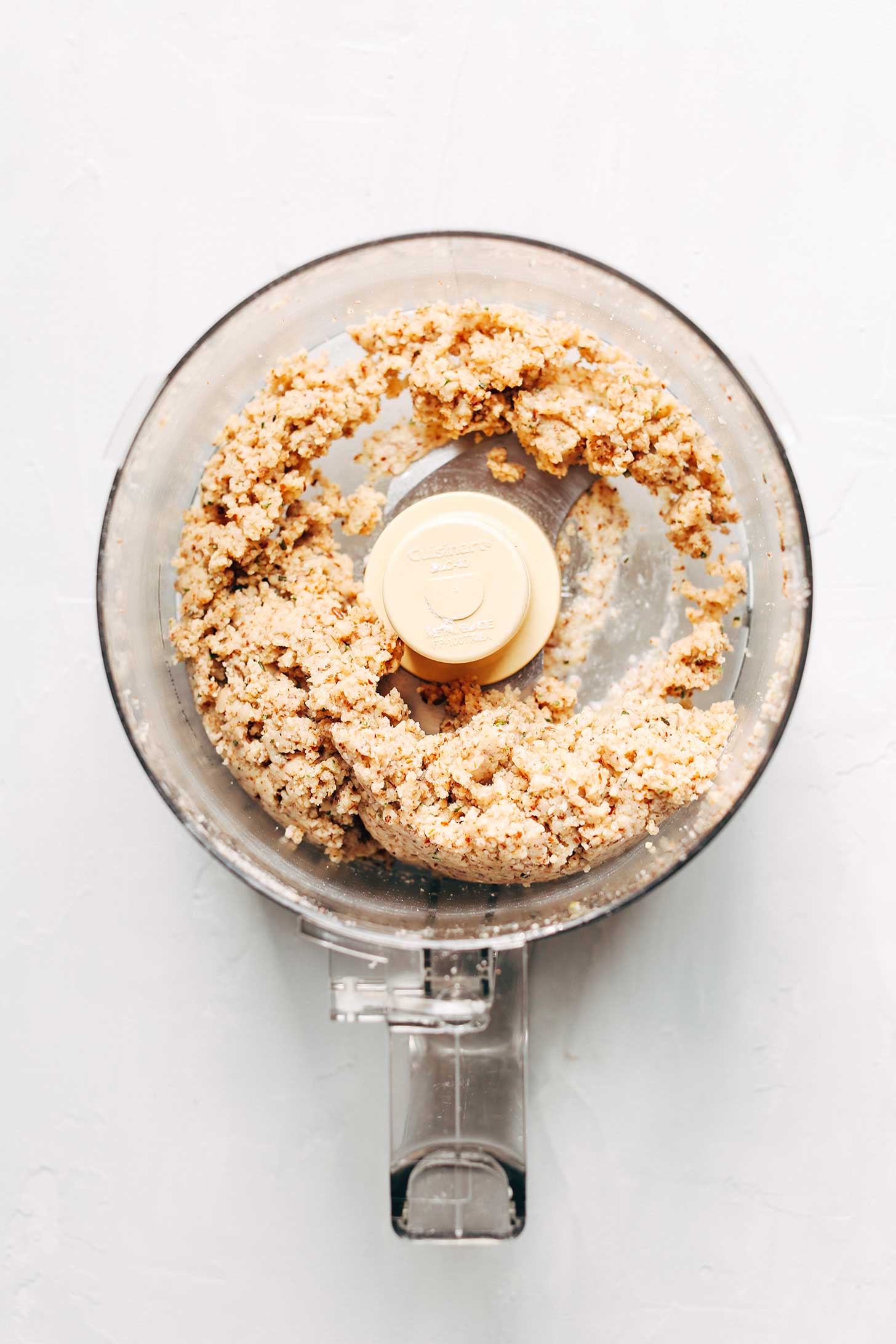 Food processor with dough ready to be made into a delicious snack of Vegan Gluten-Free Crackers