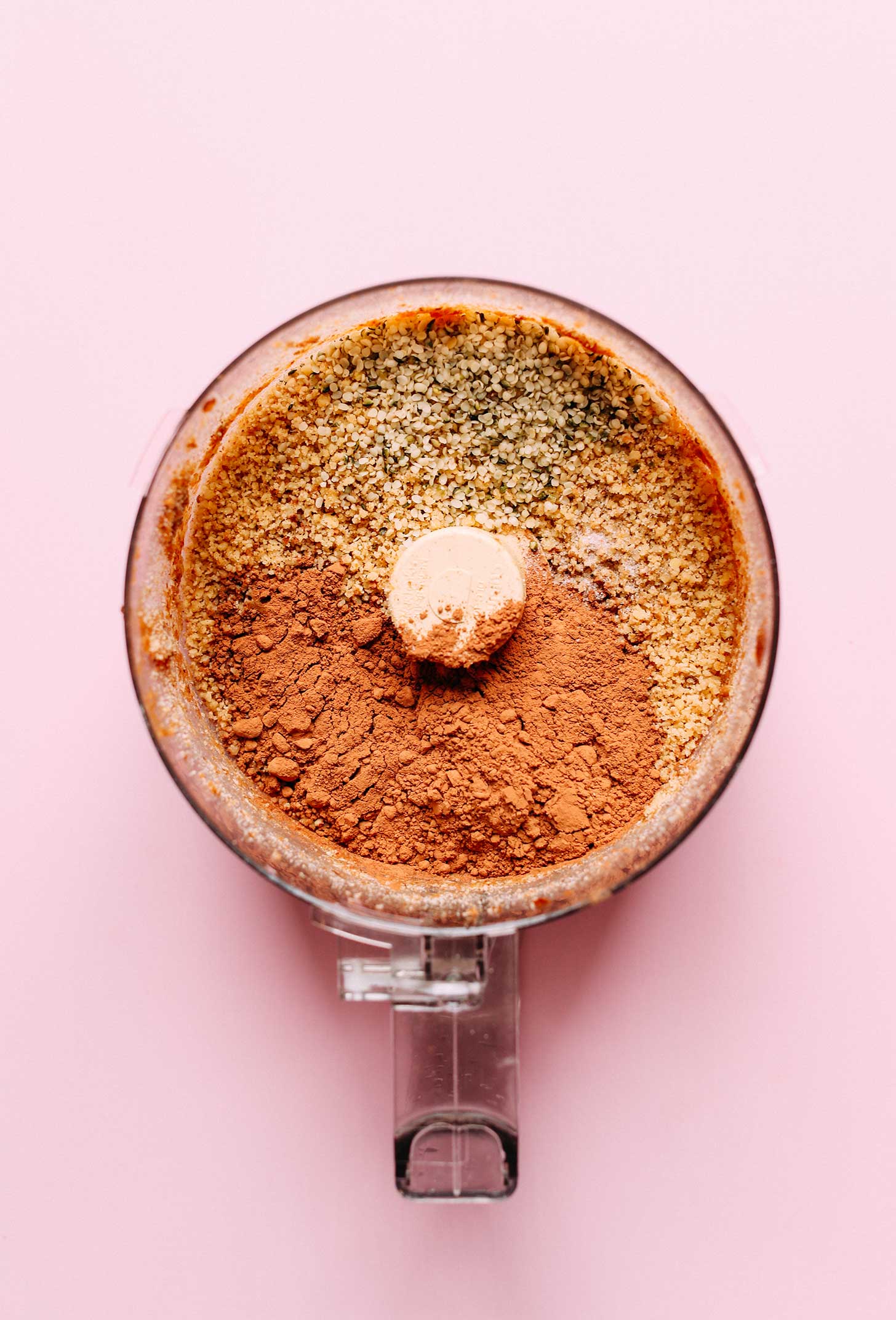 Food processor with ingredients for making naturally-sweetened gluten-free vegan energy bites