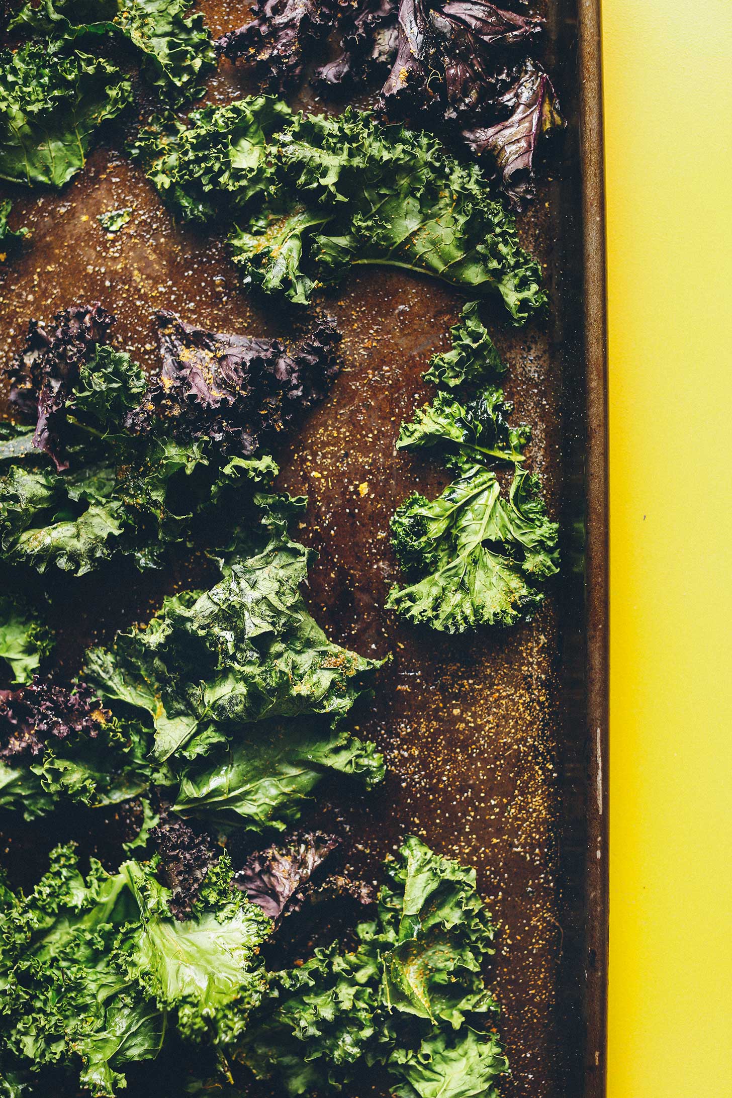 Crispy kale chips on a baking sheet