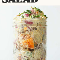 Glass jar filled with our Simple Vegan Potato Salad made with a garlic-herb cashew sauce