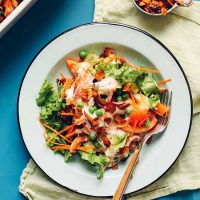 Fork resting on a plate of Vegan 7-Layer Salad