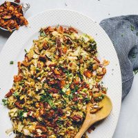 Platter of Brussels Sprout Slaw topped with Coconut Bacon