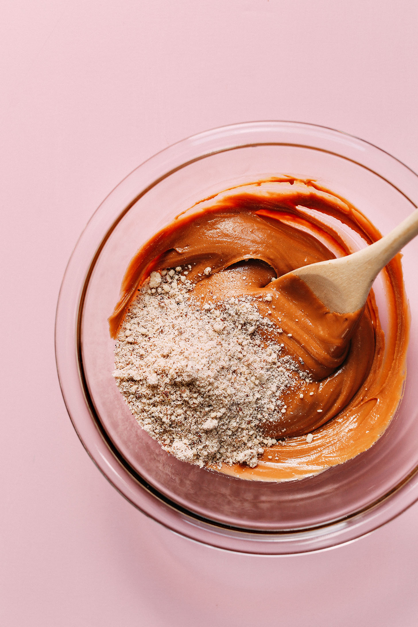 Stirring almond meal into creamy peanut butter for Vegan White Chocolate Peanut Butter Eggs