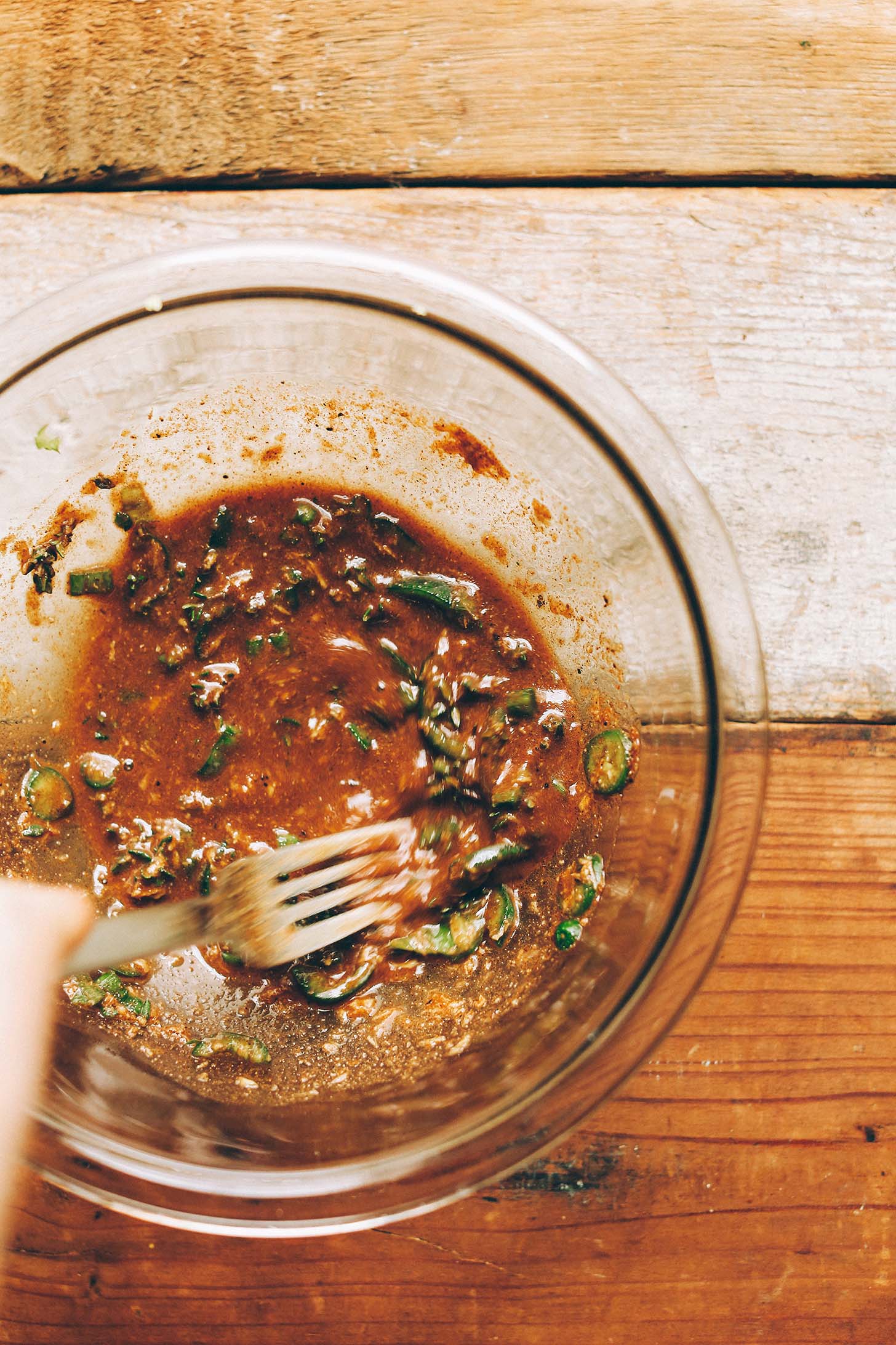 Stirring together ingredients for our gluten-free vegan Jamaican Jerk dressing recipe