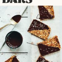 Vegan gluten-free Crunchy Baked Granola Bars on a wood plank