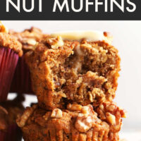 Stack of vegan and gluten-free banana nut muffins with a bite taken out of one