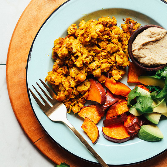 Plate of roasted sweet potato, avocado, baba ganoush, and Vegan Chickpea Scramble