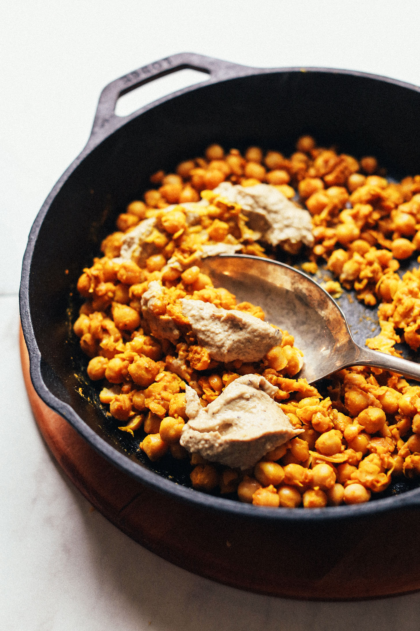 Cast iron skillet with Chickpea Scramble and baba ghanoush