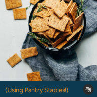 Bowl of gluten free crackers with sprigs of fresh rosemary