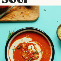 Bowl of roasted red pepper tomato soup with text above it that says ready in 30 minutes