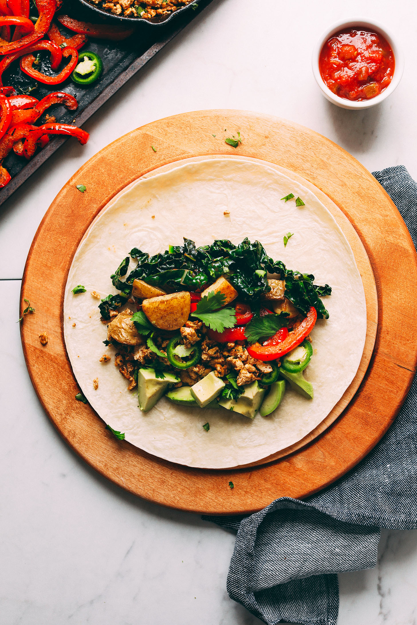 Tortilla loaded with ingredients for our Vegan Breakfast Burrito recipe