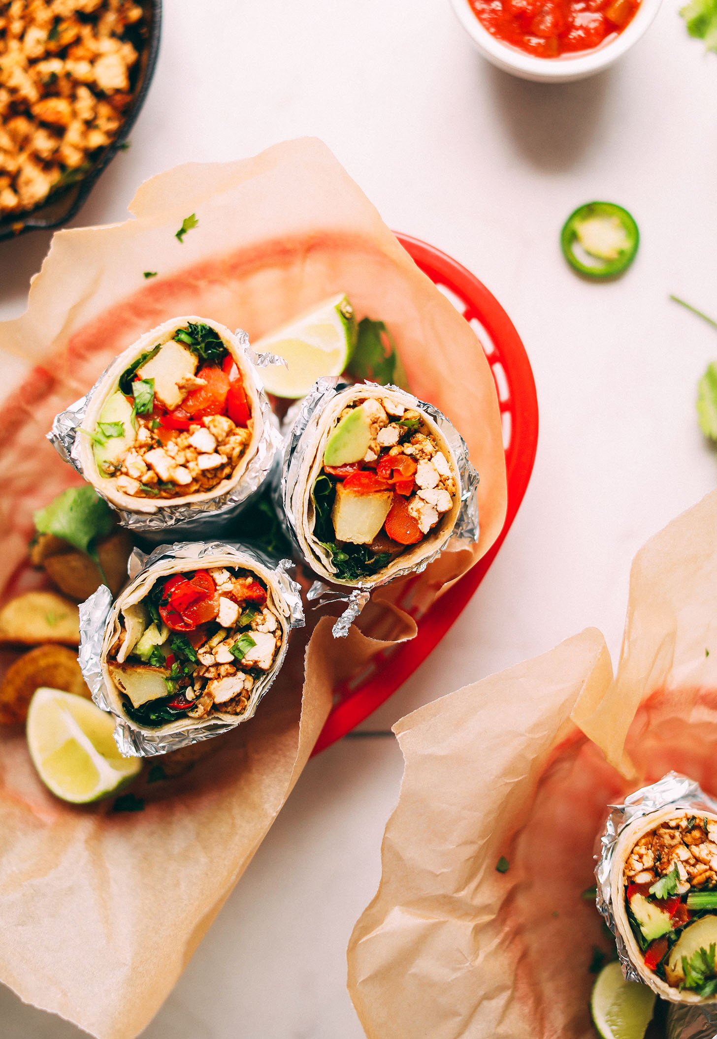 A basket filled with healthy plant-based Breakfast Burritos