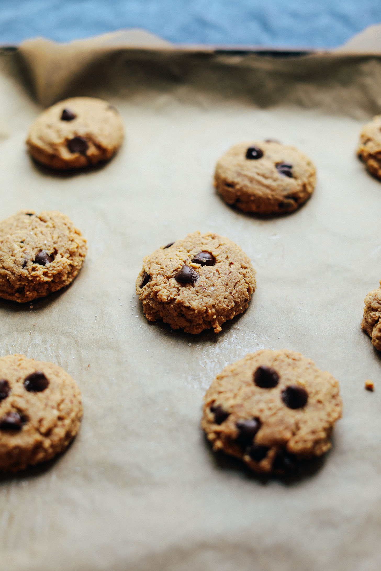 Parchment-lined baking sheet with Grain-Free Almond Butter Chocolate Chip Cookies