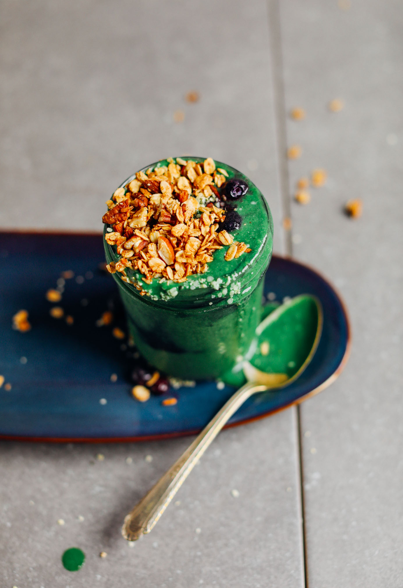 Small mason jar filled with our creamy vegan Super Green Smoothie with Spirulina