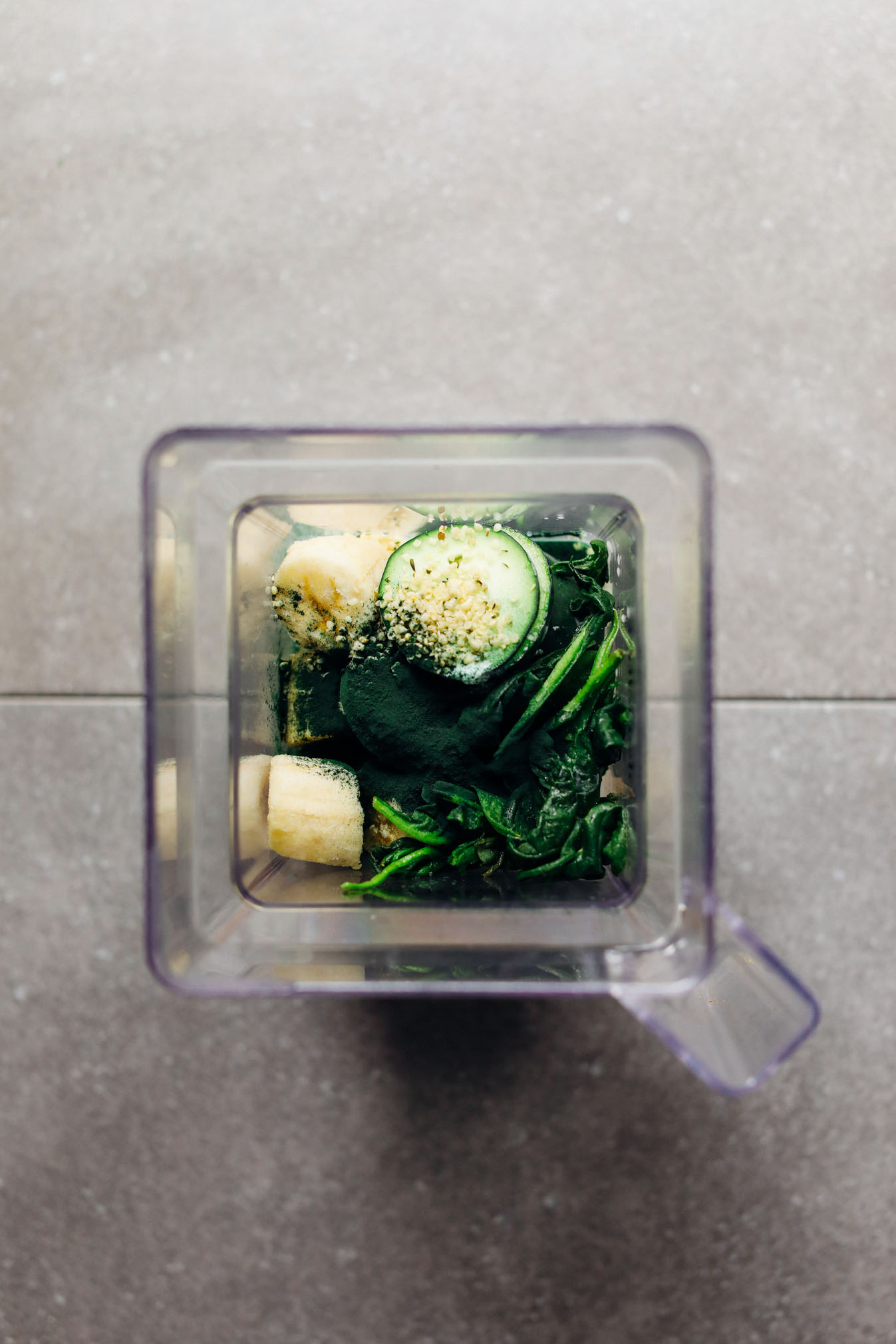 Blender with ingredients for our Super Green vegan Smoothie with Spirulina
