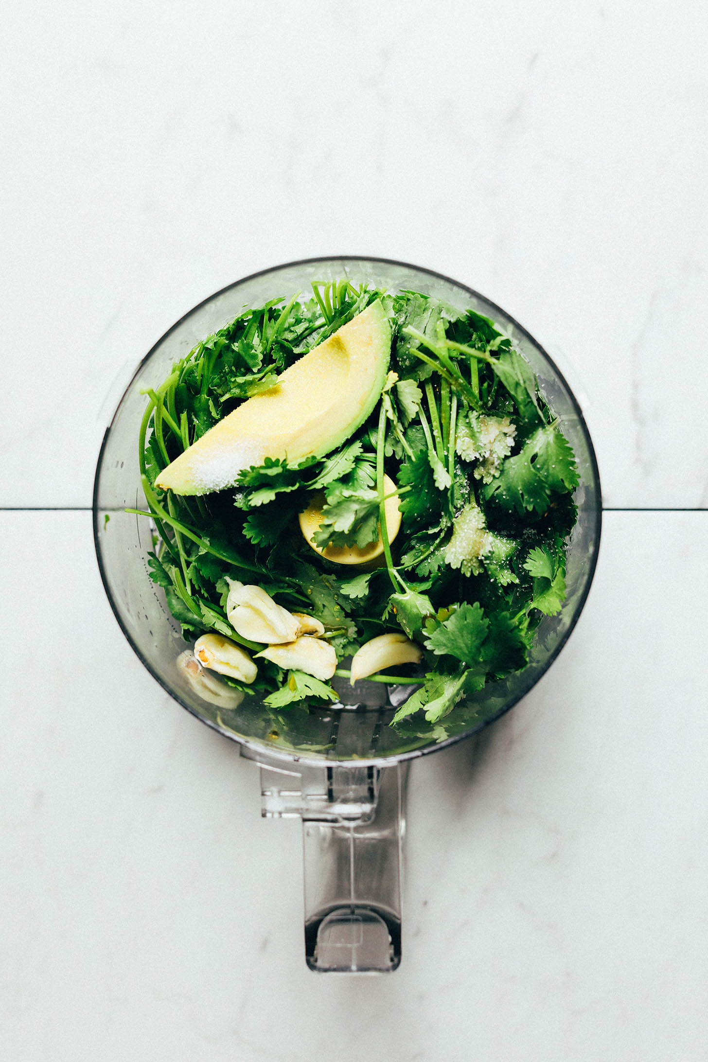 Food processor with ingredients for making green chutney for our gluten-free Vegetable Pakoras recipe