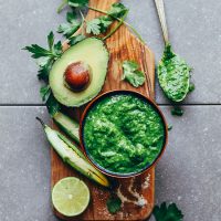 Wood board filled with ingredients for making our Vegan Chimichurri recipe