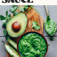 Photo of a bowl of our Magic Green Sauce next to an avocado, jalapeño, cilantro and lime with text that says ready in 10 minutes
