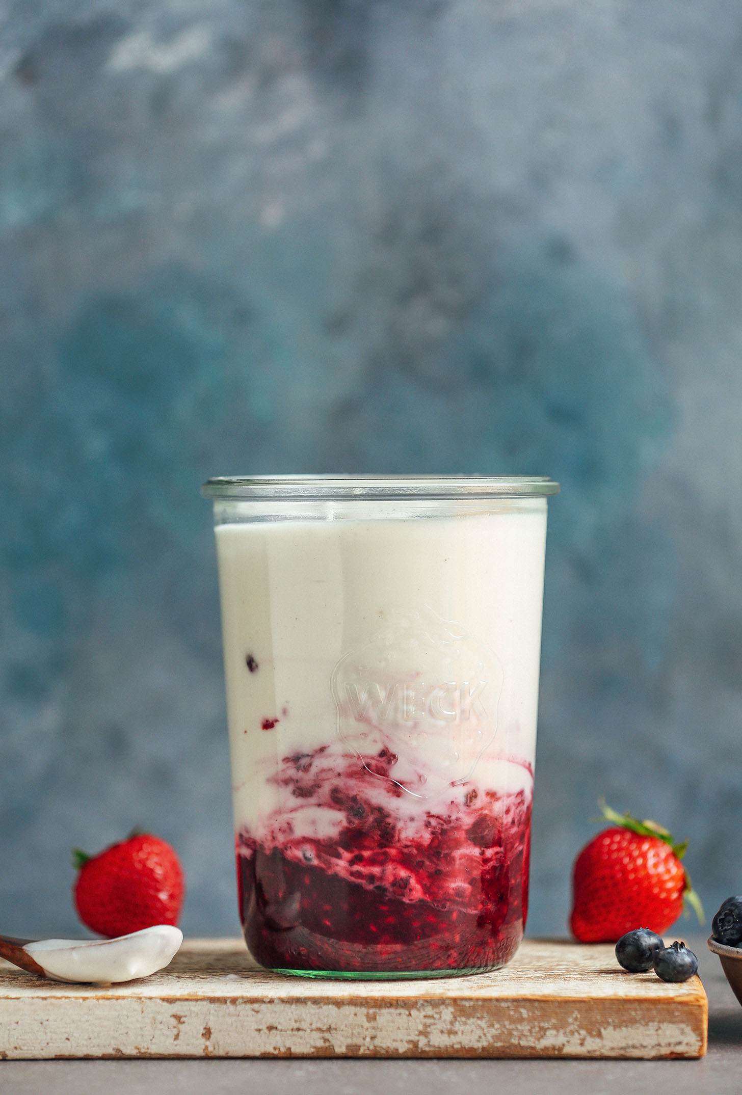 Weck jar filled with berry compote and homemade coconut yogurt using our step-by-step instructions