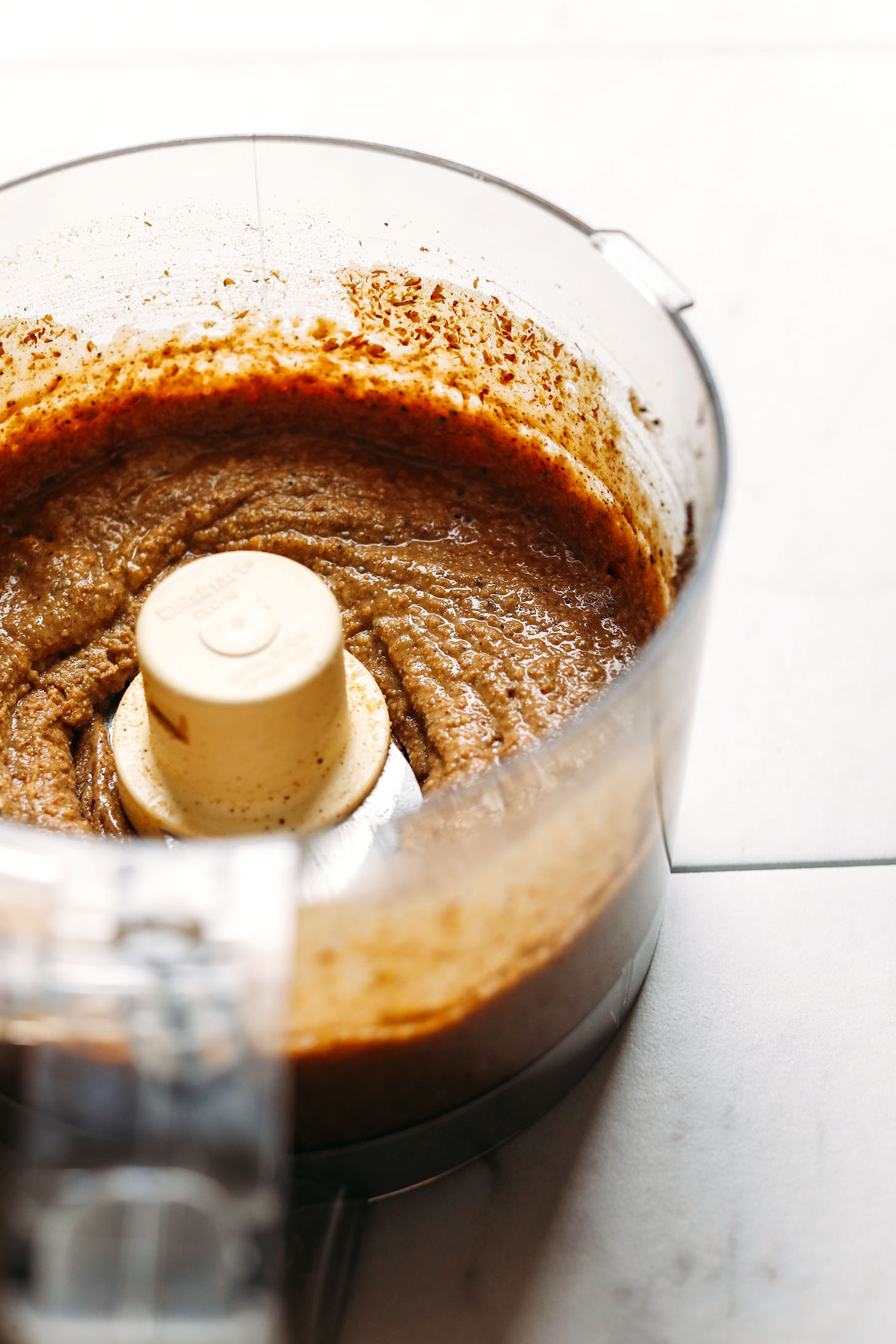 Freshly blended homemade nut butter in a food processor