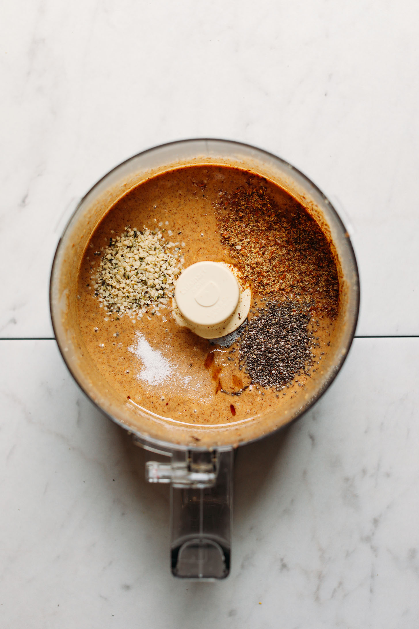 Food processor filled with homemade nut butter