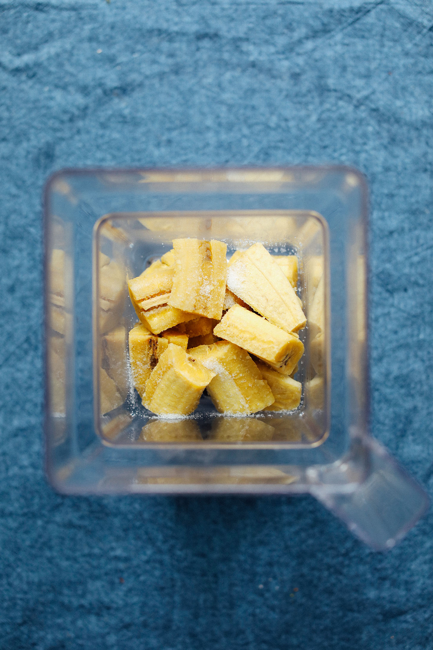 Cooked green plantains and salt in a blender