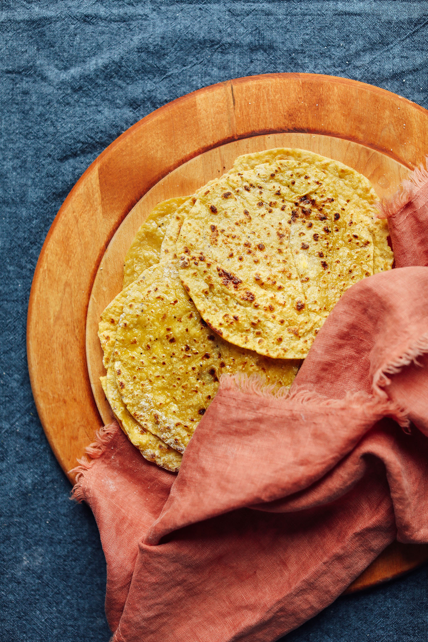 Fresh Plantain Tortillas on a wood cutting board