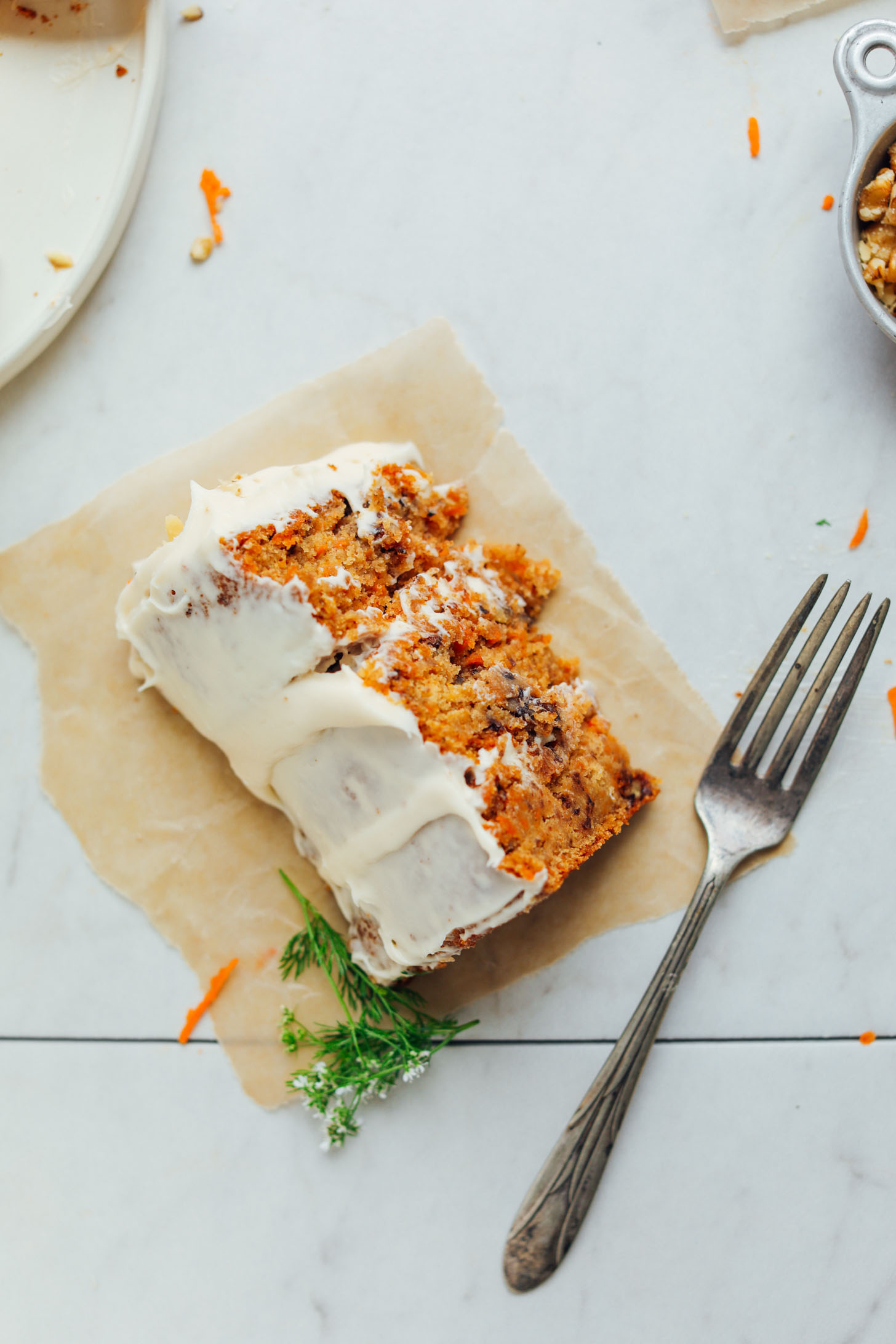 Slice of Vegan Gluten-Free Carrot Cake on a parchment paper square