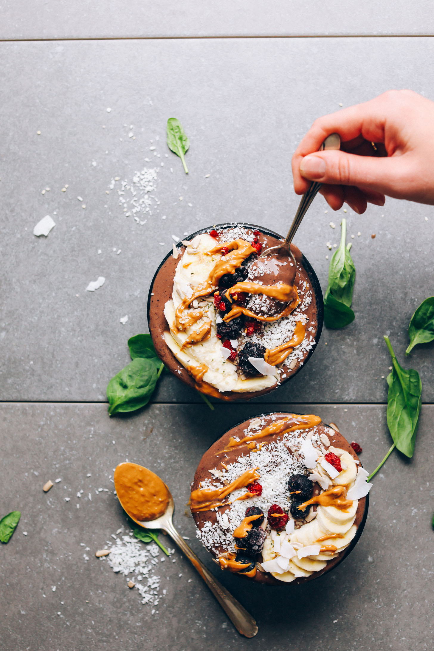 Bowls of low-sugar Peanut Butter & Jelly Acai with delicious toppings