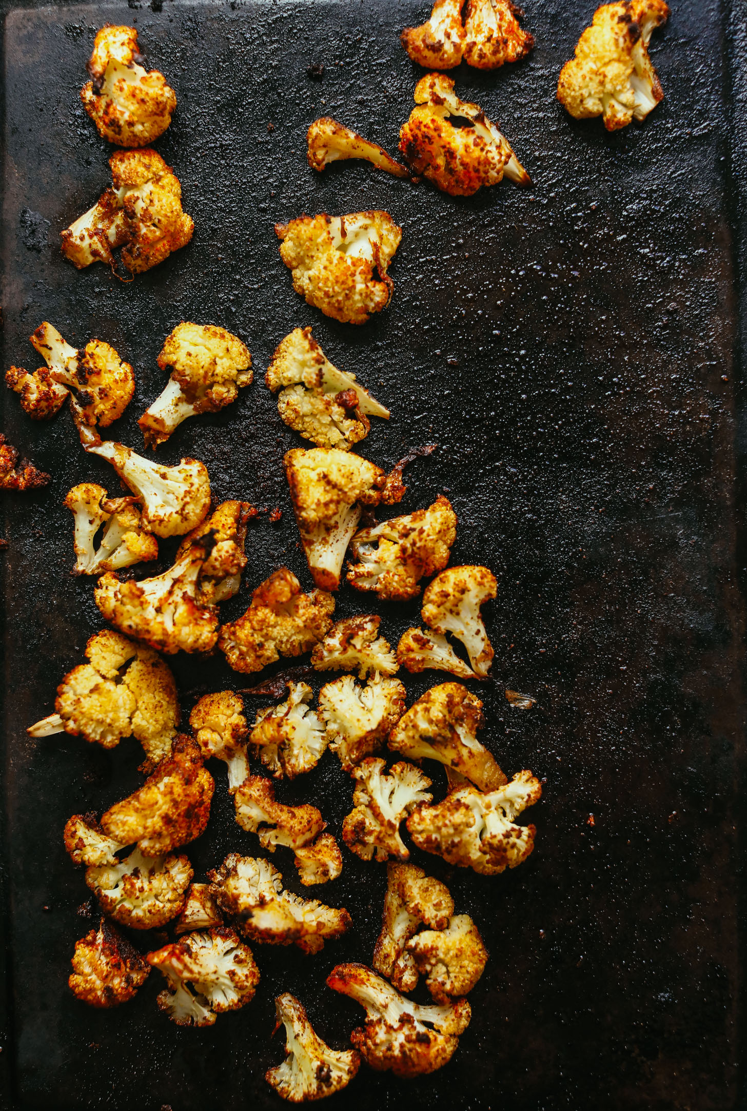 Baking sheet filled with freshly roasted cauliflower