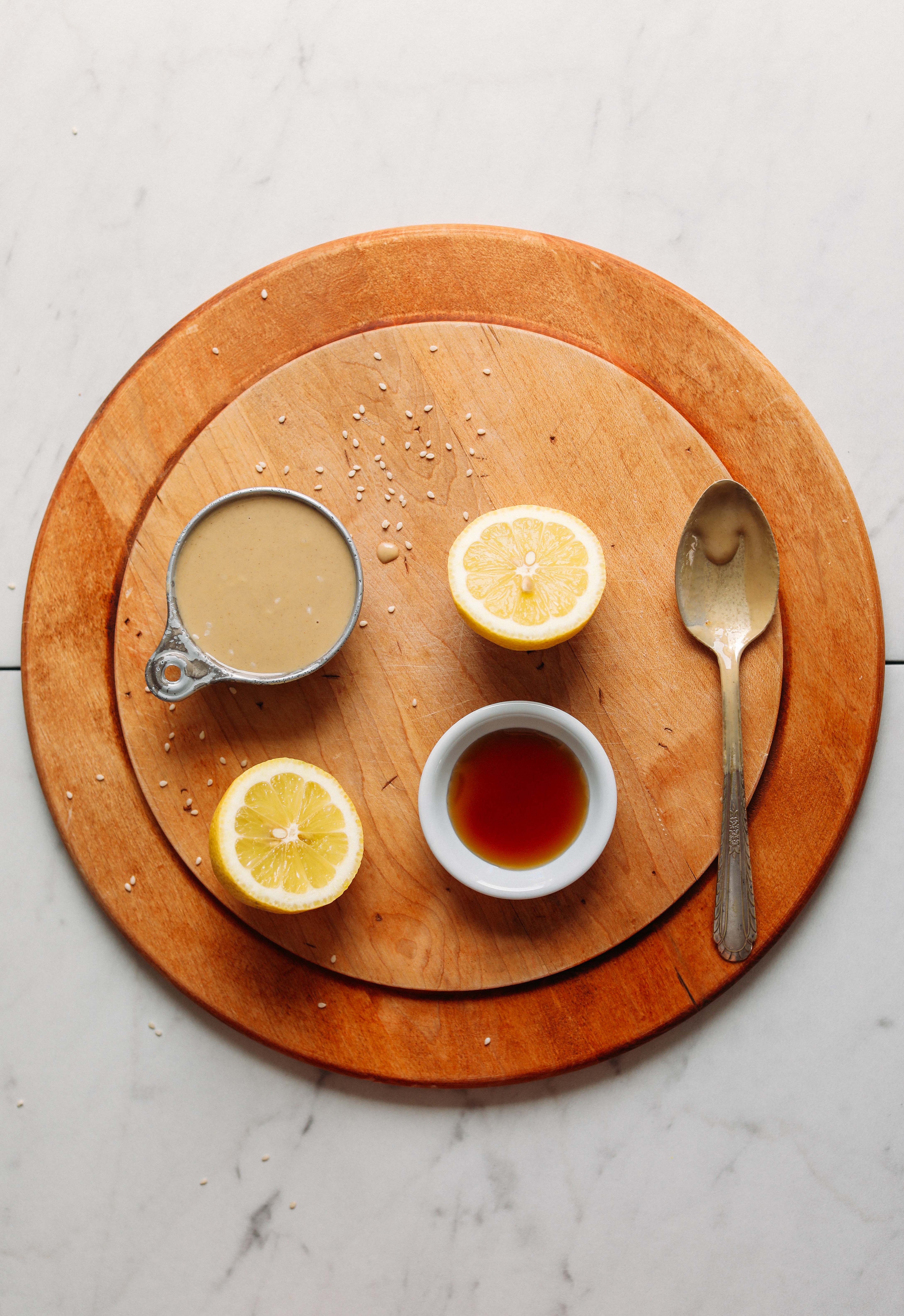 Cutting board with ingredients for our tutorial on How to Make Tahini Dressing