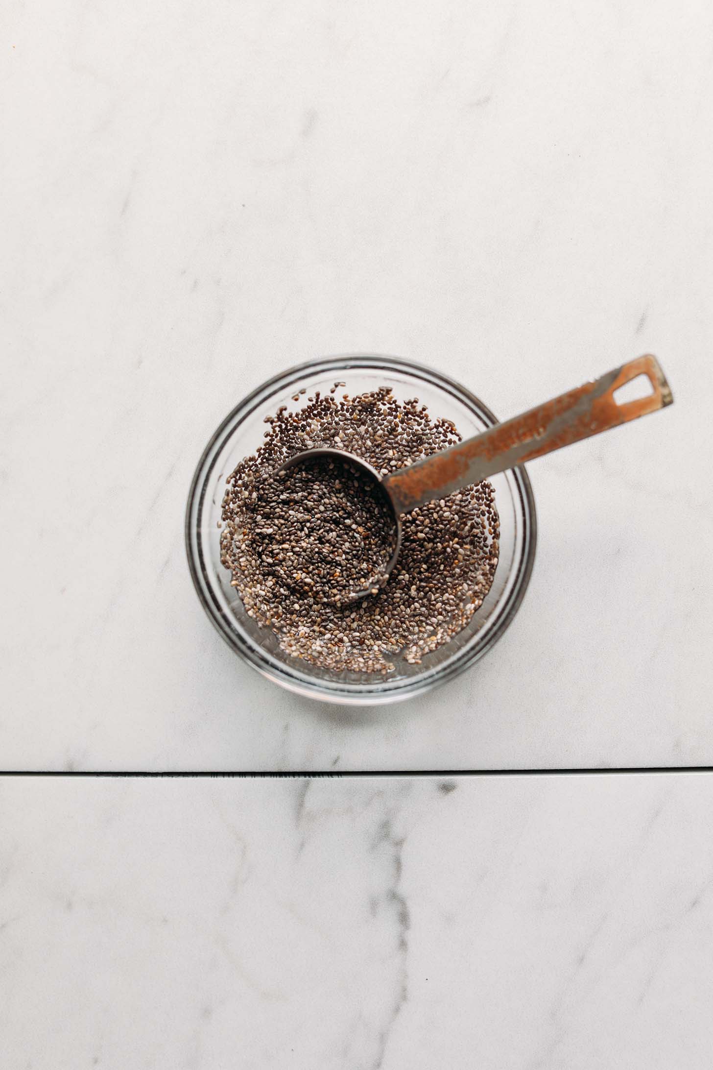 Measuring spoon in a bowl of a chia egg