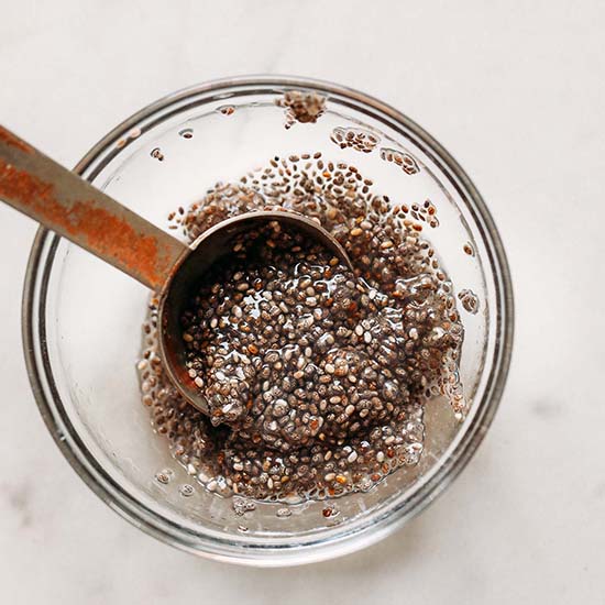 Small bowl of chia seeds and water for an vegan egg substitute