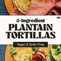 Plantain tortillas on a cutting board with some topped with taco fillings