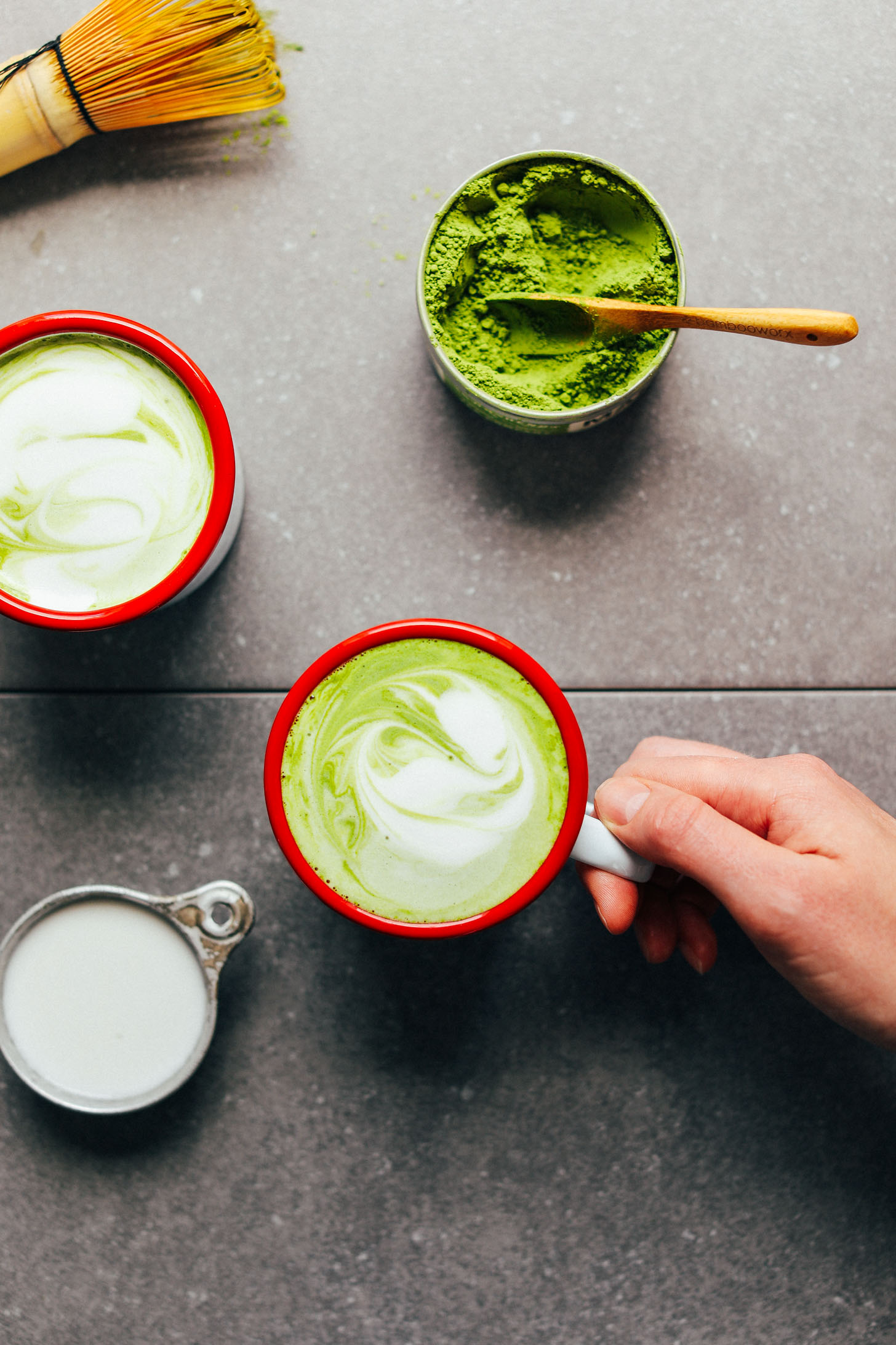 Grabbing a mug of the best matcha latte made with coconut and macadamia milks