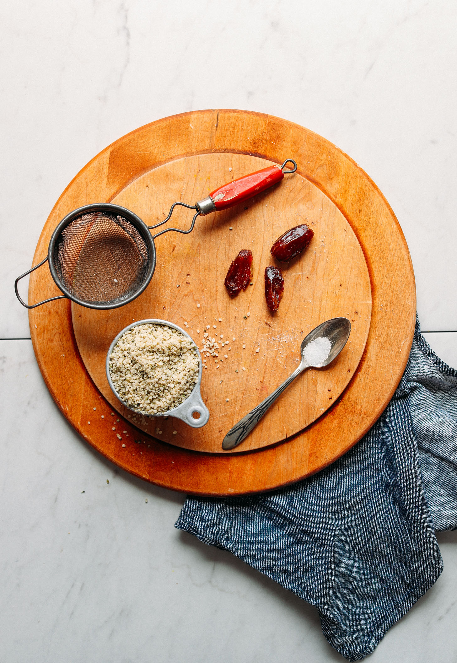 Wood cutting board with ingredients for making homemade Hemp Milk
