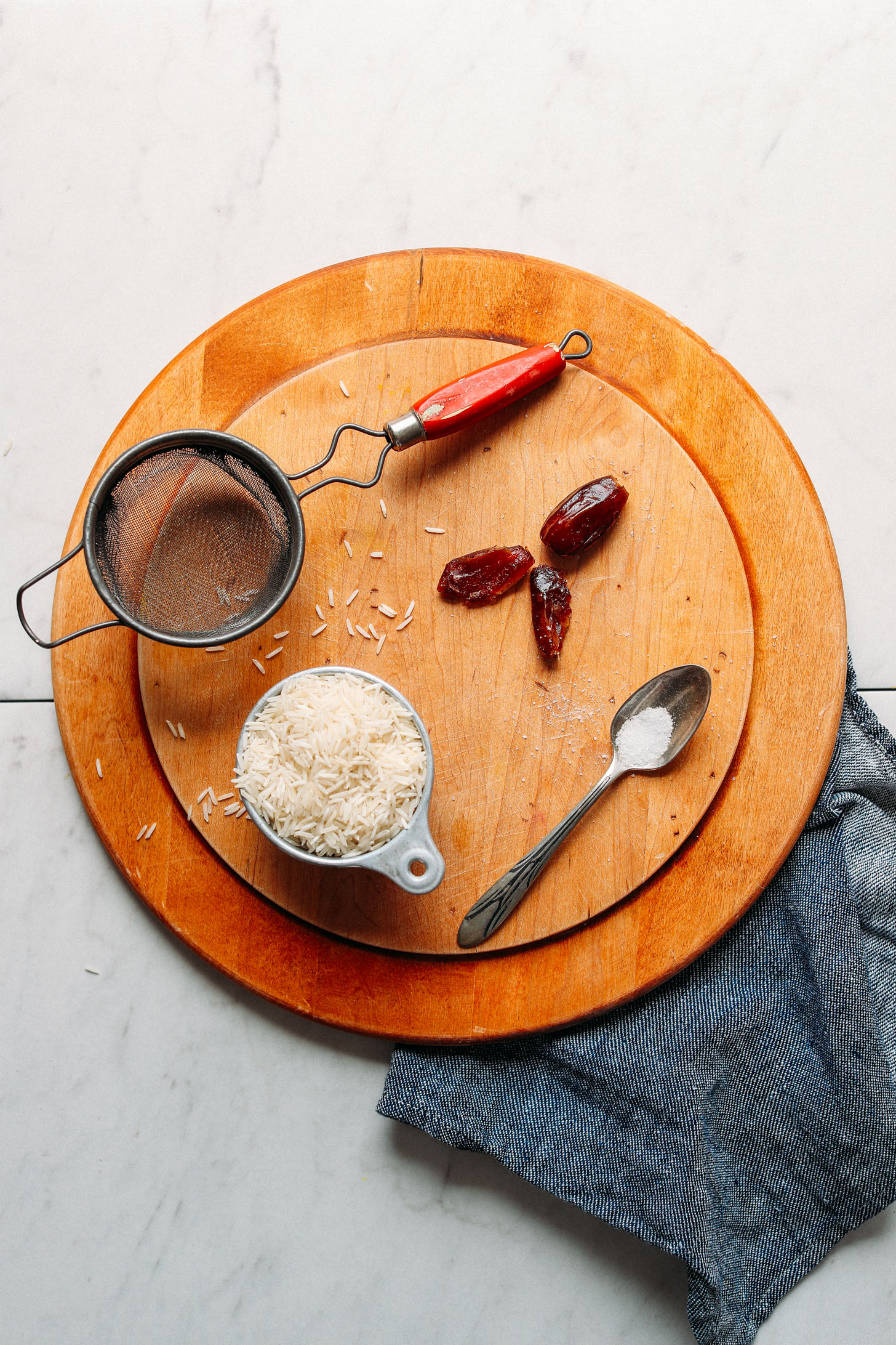 Wood cutting board with ingredients for making homemade rice milk