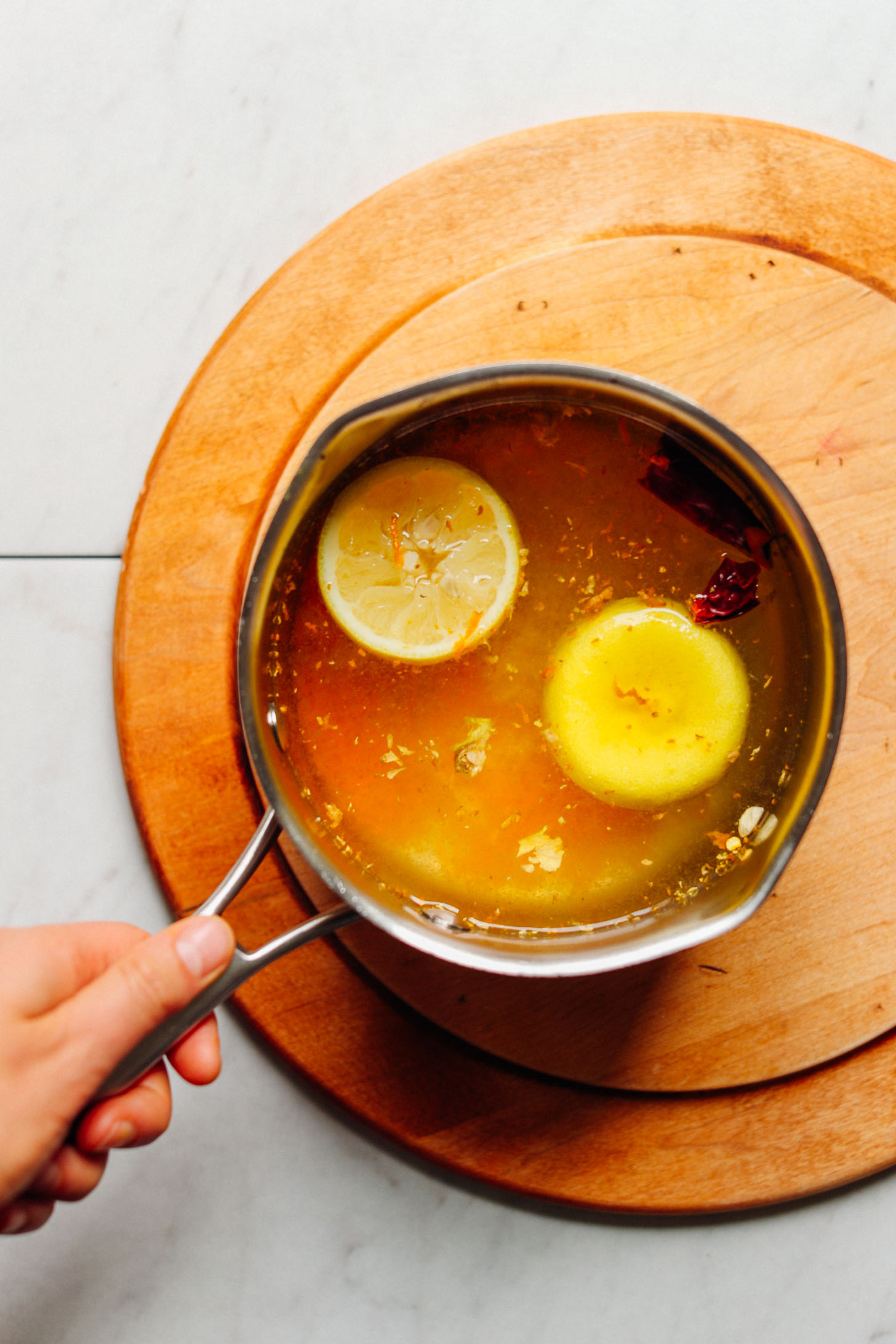 Saucepan with makings for 3-Ingredient Turmeric Ginger TONIC
