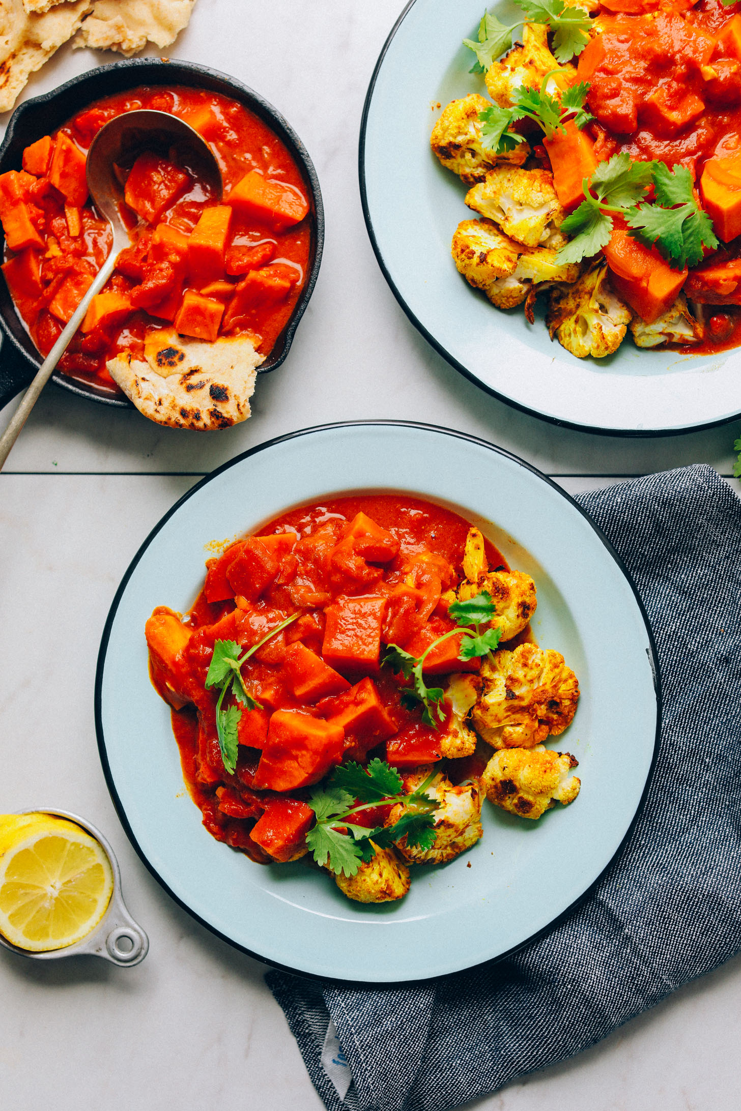 Two dinner bowls with Sweet Potato Cauliflower Curry for a speedy plant-based meal