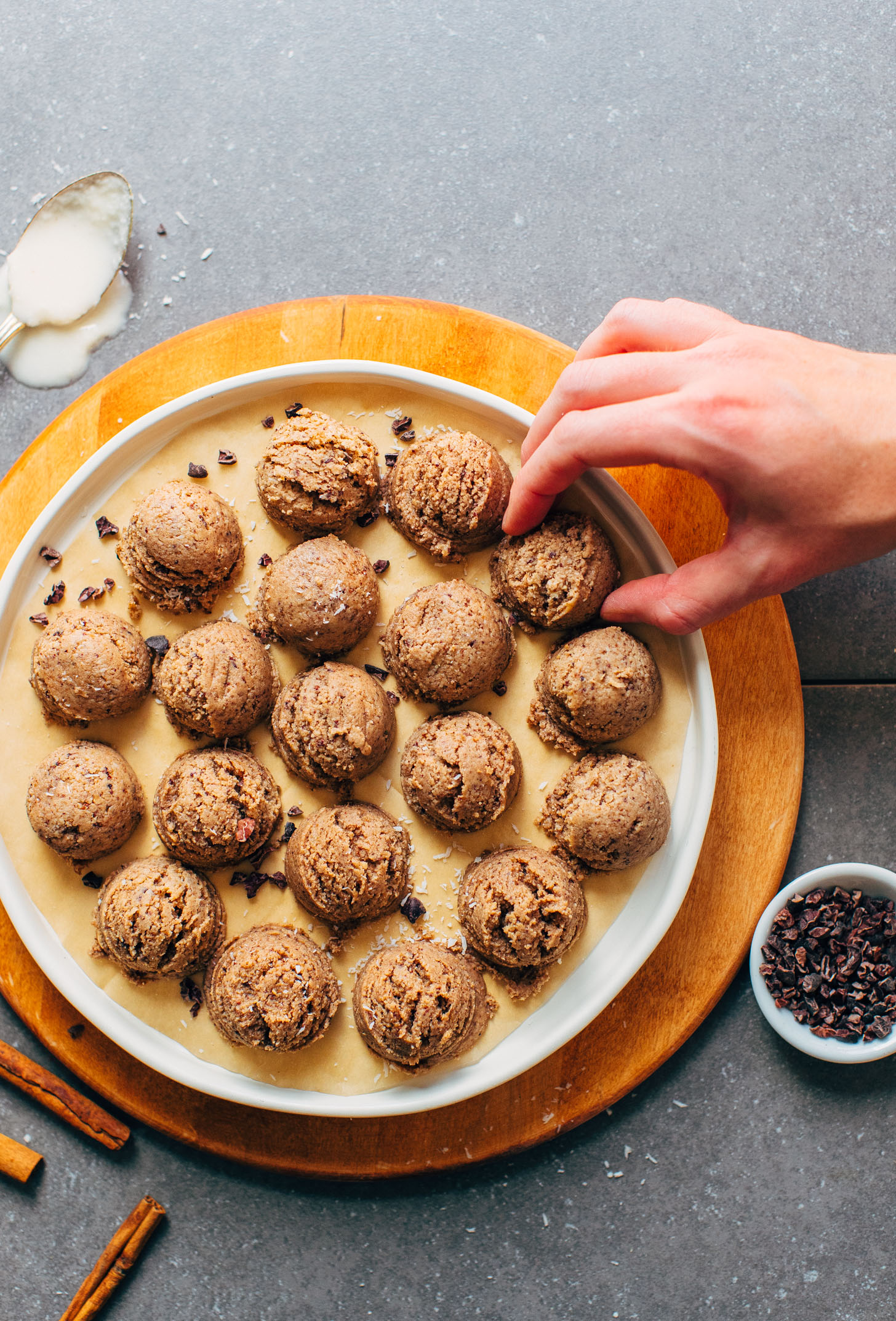 Grabbing a Coconut Cacao Tahini Snack Bite for a delicious plant-based snack