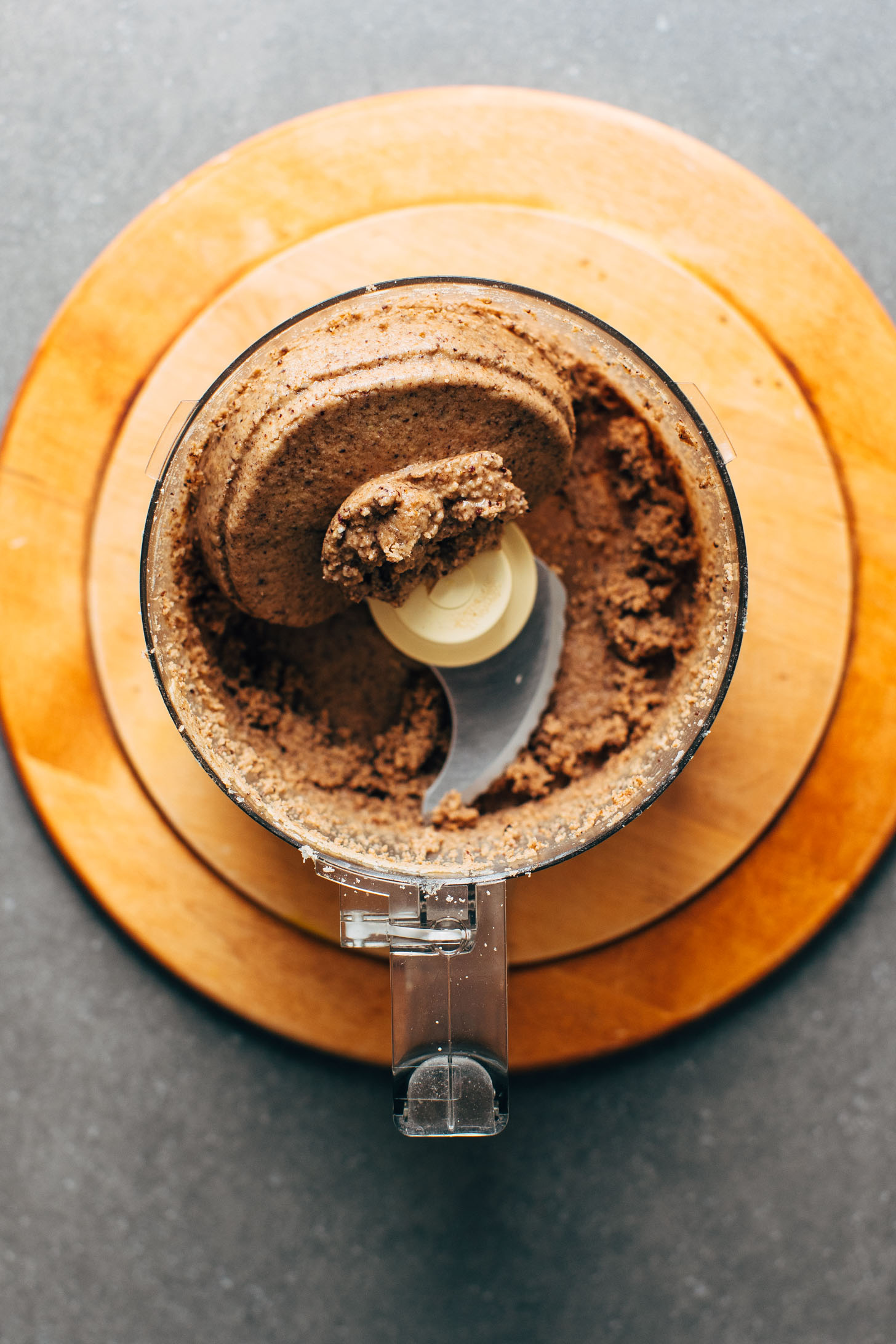 Freshly blended Coconut Cacao Tahini Snack Bites in the food processor