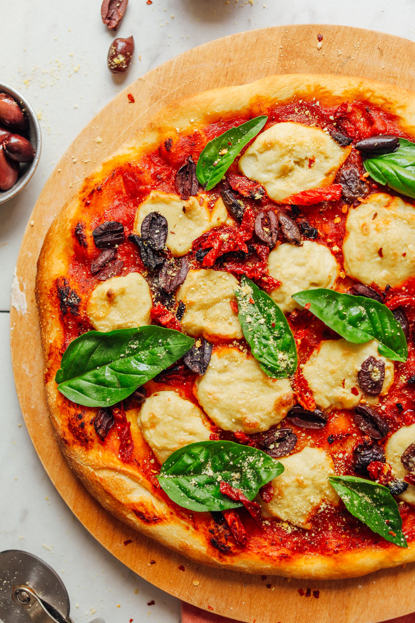 Slices of Vegan Mozzarella Cheese on a homemade pizza