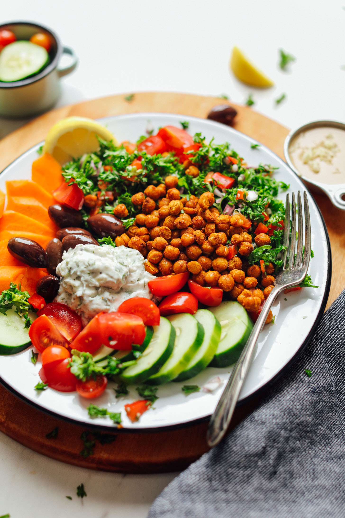 Close up shot showing the colorful ingredients in our Vegan Greek Bowl with Crispy Chickpeas, Vegan Tzatziki, and Veggies