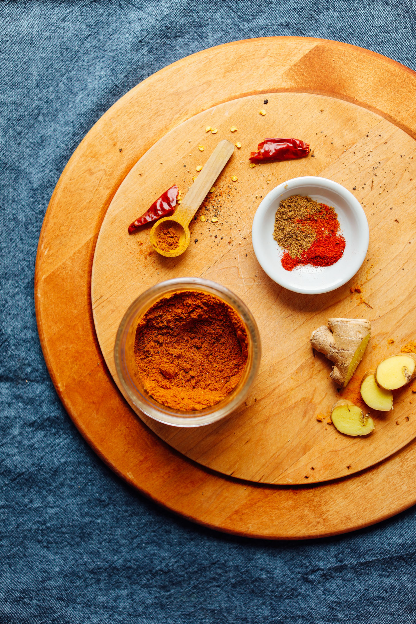 Cutting board with spices for making our DIY Shawarma Spice Blend