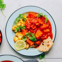 Plate with naan, roasted cauliflower, and Sweet Potato Cauliflower Curry