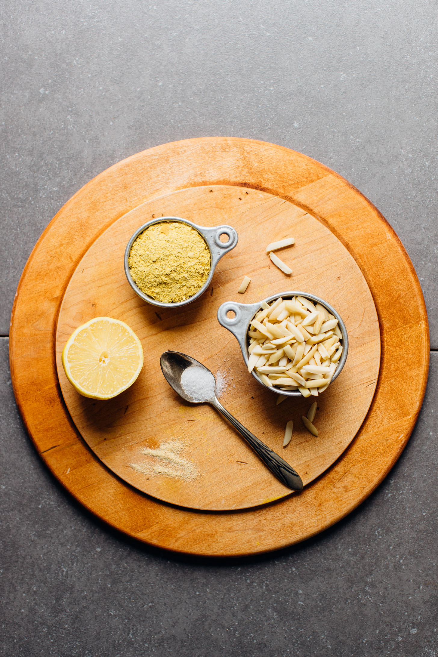 Nutritional yeast, lemon, salt, almonds, and garlic powder for making Vegan Ricotta Cheese